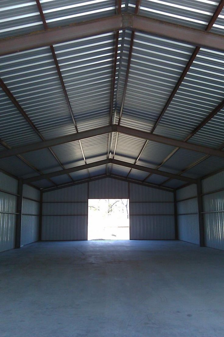 Finished steel shed interior with gable roof trusses