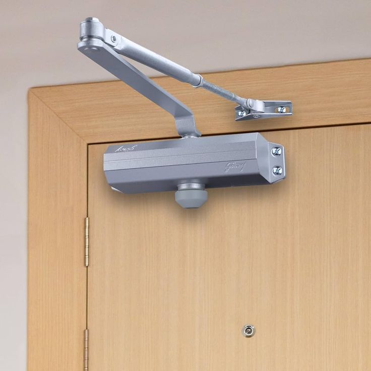 Door closer installed on wooden door